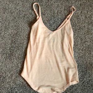 Sheer, light orange tank.